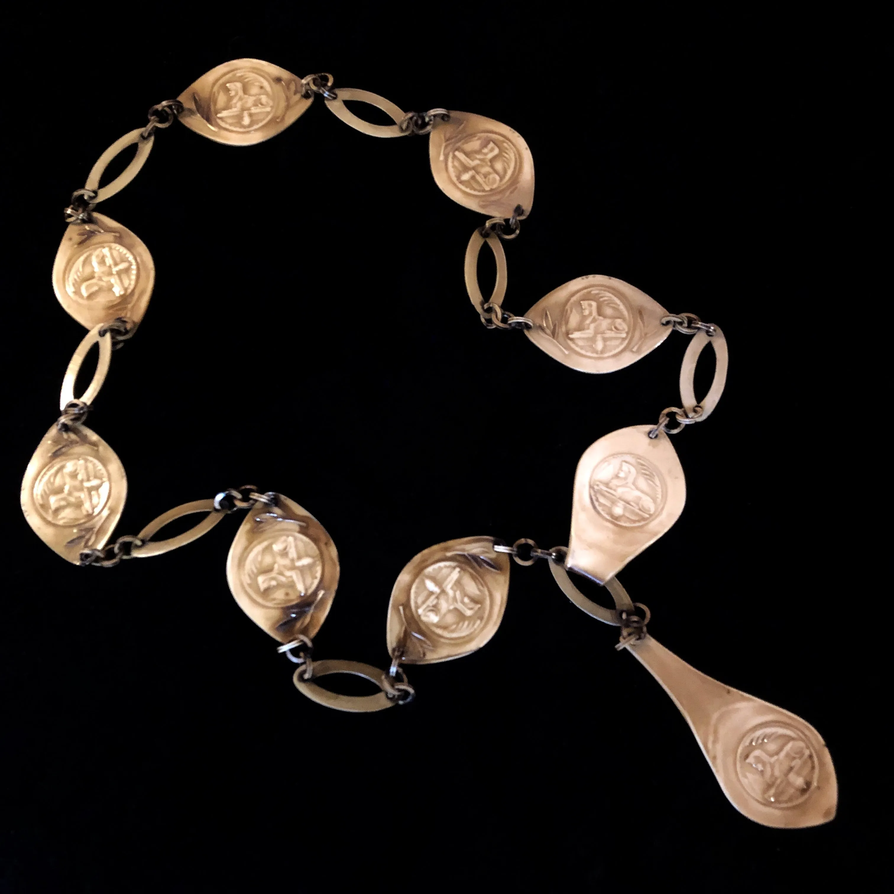A 1930s EGYPTIAN REVIVAL CELLULOID SEGMENTED BELT
