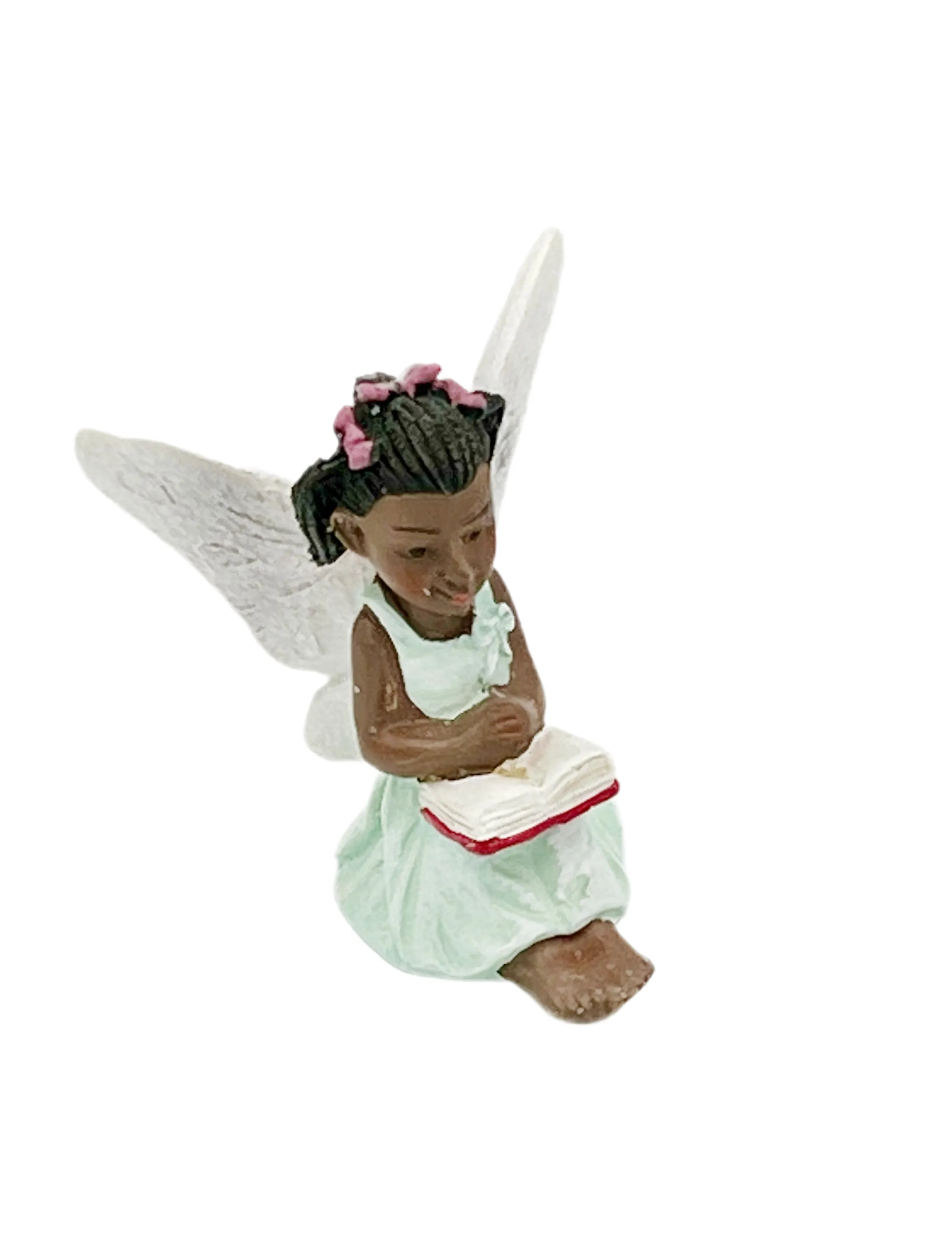 Fairy reading a book