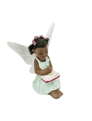 Fairy reading a book