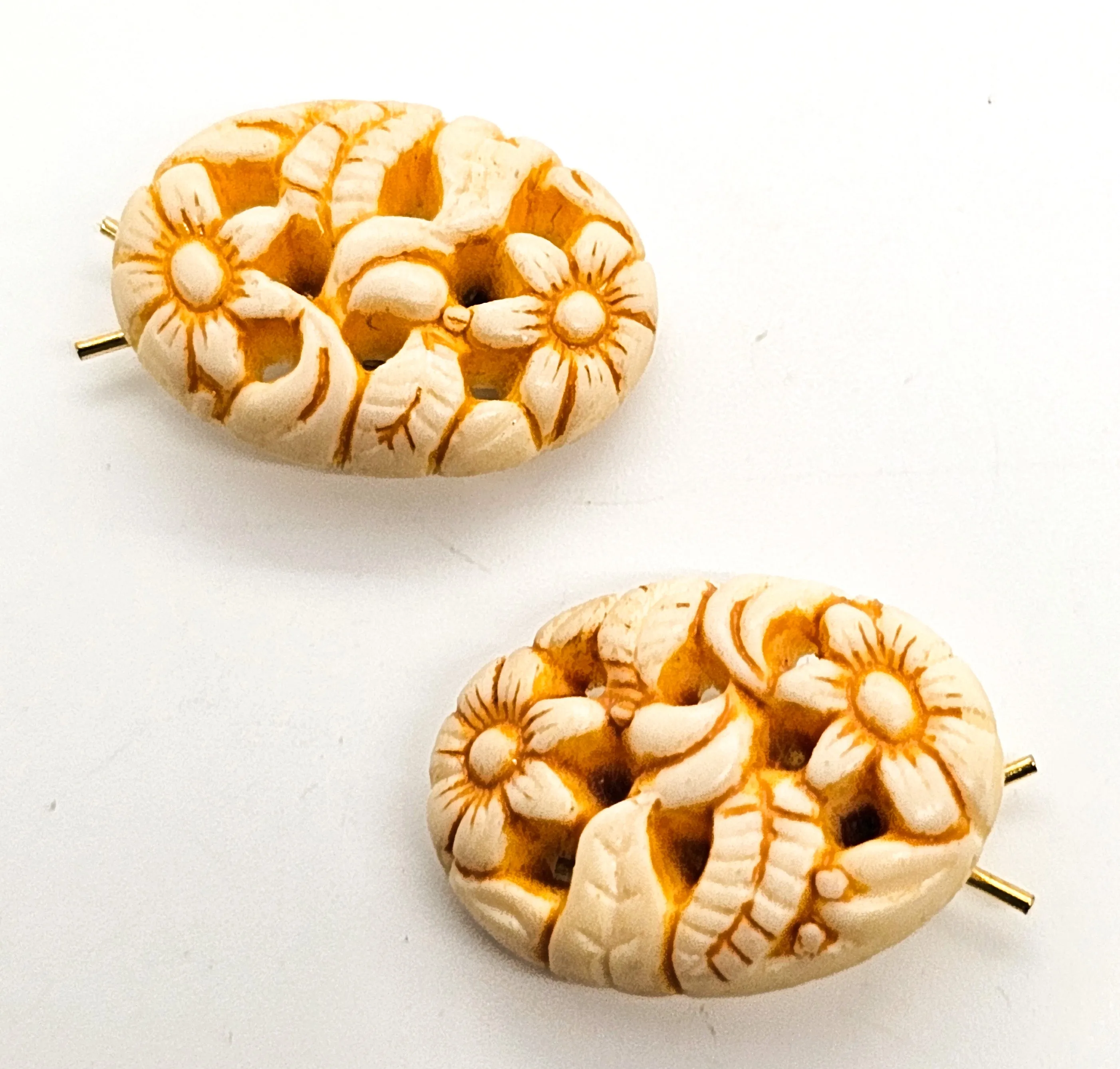 Molded pierced celluloid off-white flower pair of vintage barrettes mid century